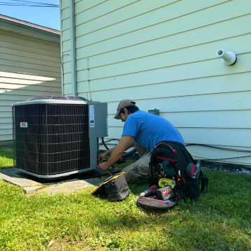 Anderson Tech working on air conditioner
