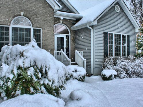 exterior of a house covered in snow